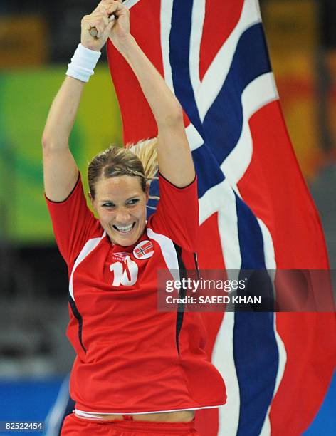 Norway's Gro Hammerseng celebrates after defeating Russia in the women's handball gold medal match of the 2008 Beijing Olympic Games on August 23,...