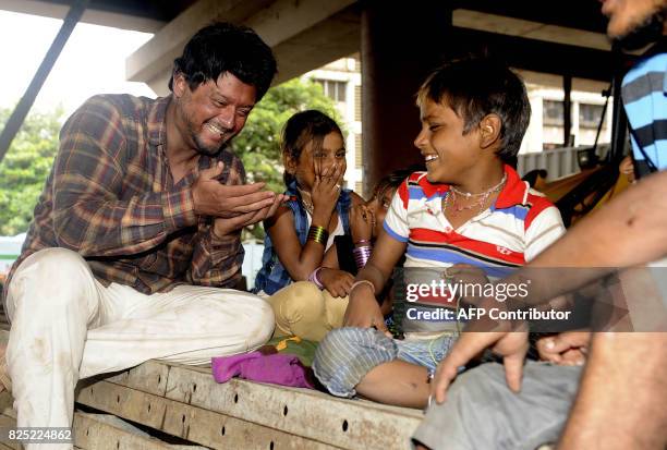 Indian Bollywood and Marathi film actor Swapnil Joshi meets homeless residents during a promotional event for the forthcoming Marathi film 'Bhikhari'...