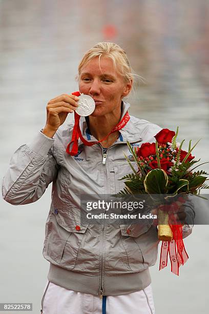 Josefa Idem of Italy celebrates with her silver medal after finishing second in the Kayak Single 500m Women Final part of the canoe/kayak flatwater...