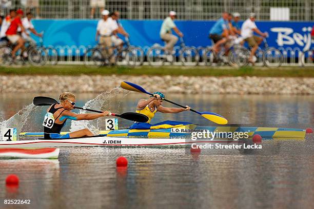 Inna Osypenko-Radomska of Ukraine beats Josefa Idem of Italy to first place in the Kayak Single 500m Women Final, part of the canoe/kayak flatwater...