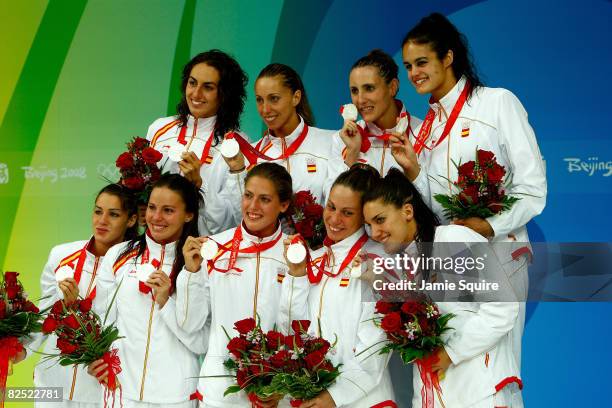 The Spain synchronized swim team receive their silver medals during the medal ceremony for the free routine final at the National Aquatics Center on...