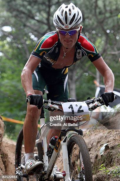 Burry Stander of South Africa competes in the Men's Cross Country mountain bike cycling event held at the Laoshan Mountain Bike Course on Day 15 of...