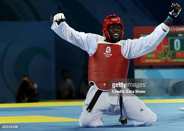 Angel Valodia Matos of Cuba celebrates defeating Liu Xiaobo of China in the Men's +80kg quarterfinals held at the University of Science and...
