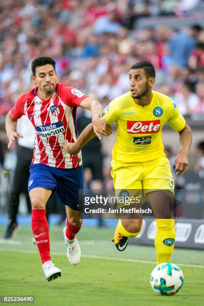 Nicolas Gaitan of Atletico Madrid and Faouzi Ghoulam of SSC Napoli fight for the ball during the Audi Cup 2017 match between Club Atletico de Madrid...