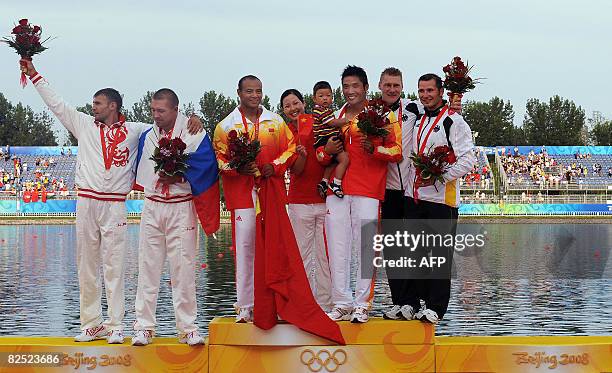 China's Meng Guanling hold his son Meng Yu Huang while his wife Xu Feng Yue looks on and Yang Wenjun, Russia's Sergey Ulegin and Alexander Kostogold...