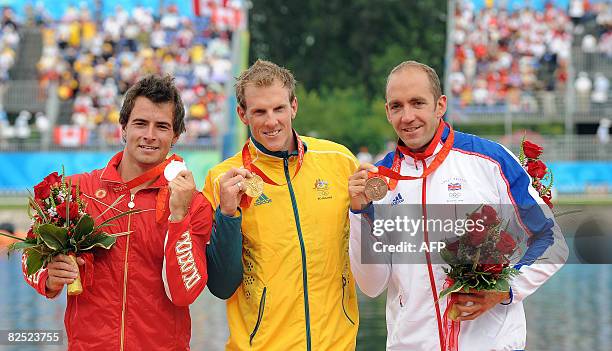 Autralia's Ken Wallace , Canada's Adam van Koeverden and Great Britain's Tim Brabants pose with their medals following the medals ceremony after...