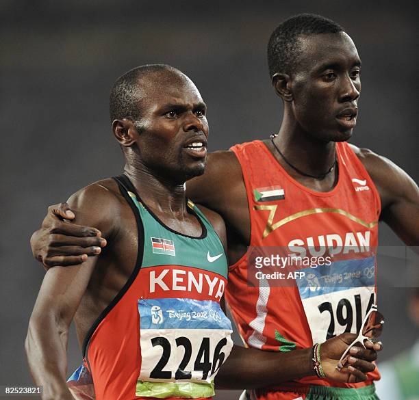 Sudan's Ismail Ahmed Ismail hugs Kenya's Wilfred Bungei after competing in the men's 800m final at the "Bird's Nest" National Stadium during the 2008...