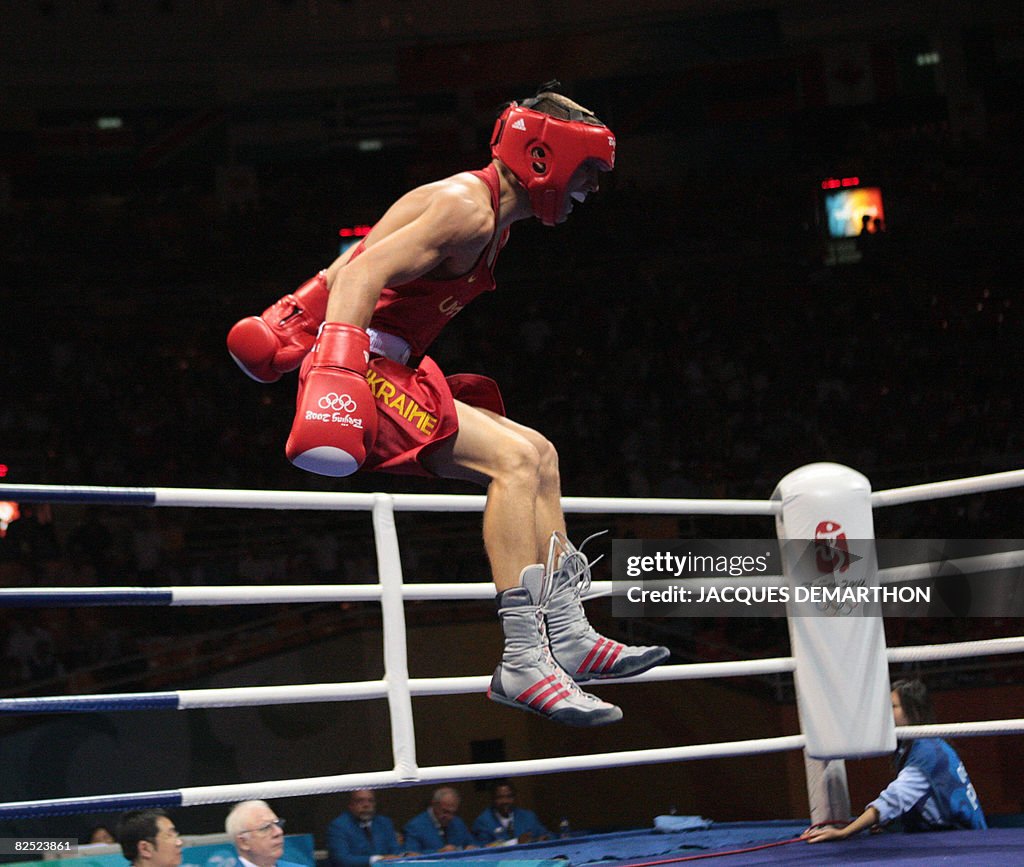 Ukraine's Vasyl Lomachenko celebrates hi