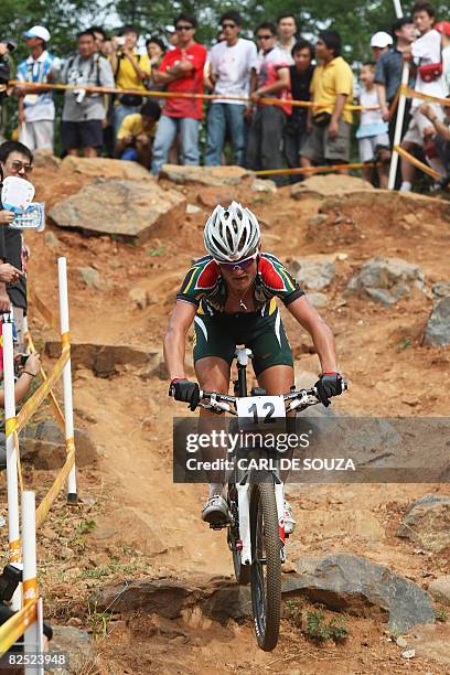 South Africa's Burry Stander competes in the men's cross country mountain bike race at the Beijing 2008 Olympic Games at Laoshan Cycling venue in...