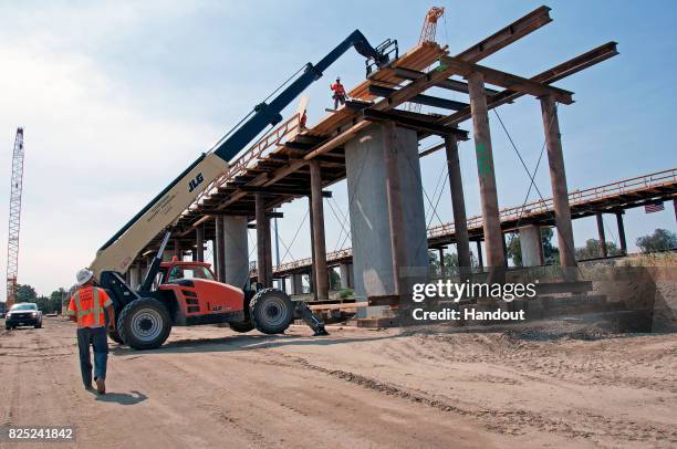 In this handout image provided by the California High-Speed Rail Authority, Construction of the San Joaquin River Viaduct seen and is an...