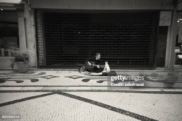 street musician in lisbon - instant print black and white stock pictures, royalty-free photos & images