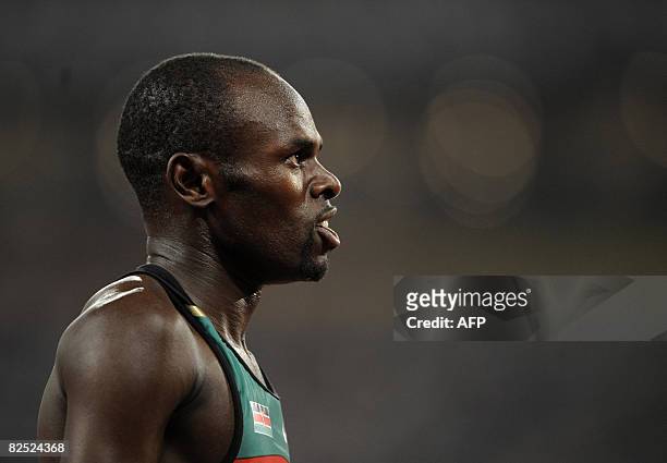 Kenya's Wilfred Bungei looks at his score after competing in the men's 800m final at the "Bird's Nest" National Stadium during the 2008 Beijing...