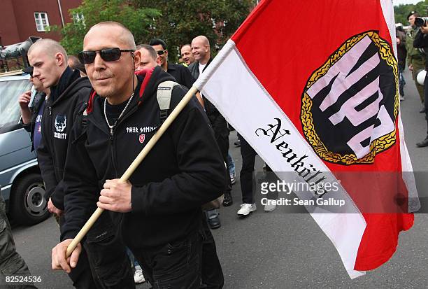 Supporters of the NPD, the right-wing German political party, march with a sign demanding an end to the construction of mosques in Germany in the...