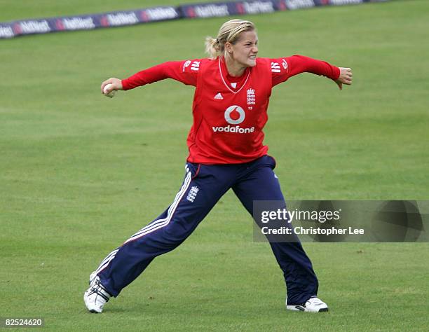 Katherine Brunt of England throws the ball high into the air as she celebrates catching out Susan Benade of South Africa during the Women's Second...