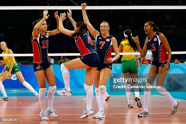 The United States players celebrate during the women's gold medal volleyball game held at the Beijing Institute of Technology Gymnasium on Day 15 of...