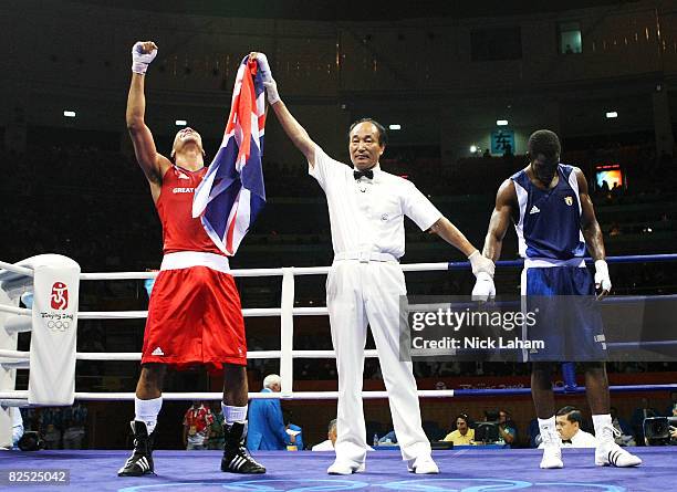 James Degale of Great Britain celebrates as he is awarded victory by the judges against Emilio Correa Bayeaux of Cuba in the Men's Middle Final Bout...