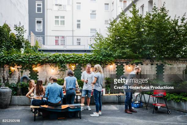 young, stylish group of friends meet together for a barbecue - berlin summer stock pictures, royalty-free photos & images