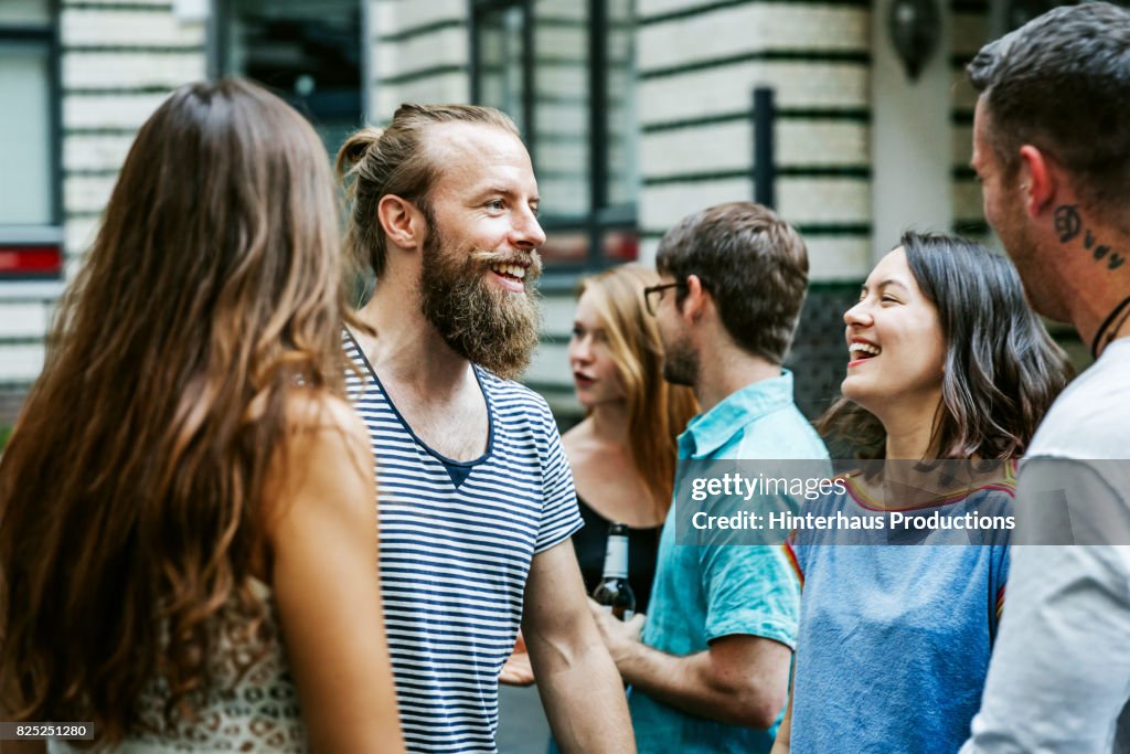 A Group Of Friends Meeting Together At Barbecue