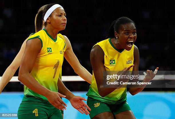 Walewska Oliveira and Fabiana Claudino of Brazil celebrate during the women's gold medal volleyball game held at the Beijing Institute of Technology...