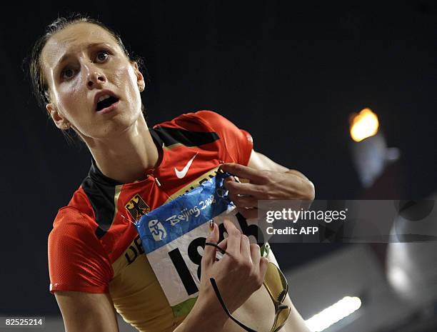 Germany's Ariane Friedrich reacts after finishing seventh in the women's high jump final at the "Bird's Nest" National Stadium during the 2008...