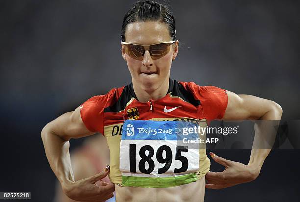 Germany's Ariane Friedrich reacts after finishing seventh in the women's high jump final at the "Bird's Nest" National Stadium during the 2008...