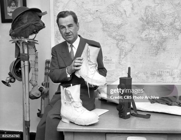 Television program, High Adventure with Lowell Thomas. Episode title: India . Pictured here is CBS newsman Lowell Thomas at the offices of Odyssey...