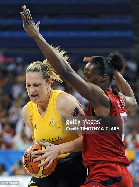 Australia's Suzy Batkovic vies with USA's Sylvia Fowles during the women's basketball gold medal match Australia against The US of the Beijing 2008...