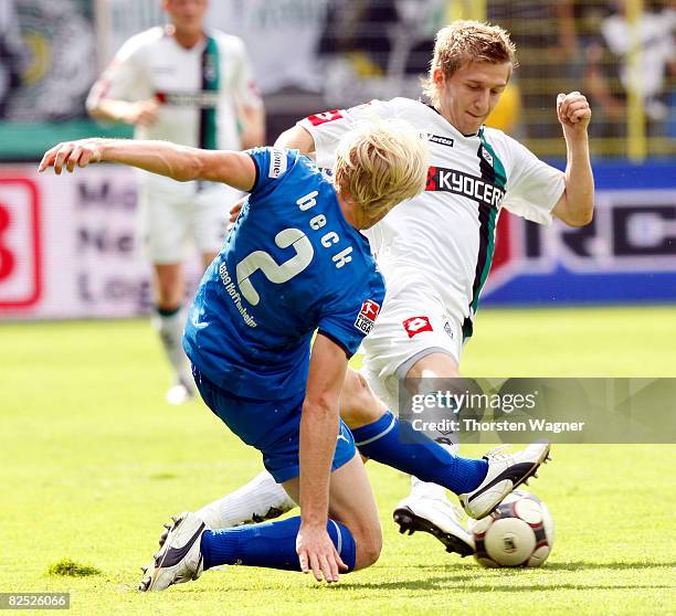 Andreas Beck of TSG 1899 Hoffenheim battles for the ball with Marco Marin of Borussia Moenchengladbac during the Bundesliga match TSG 1899 Hoffenheim...