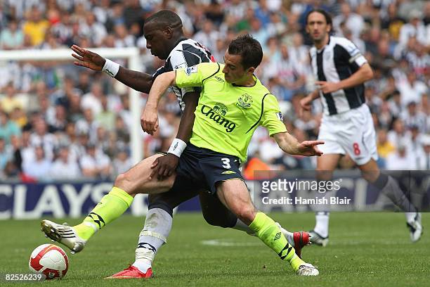 Ishmael Miller of West Bromwich contests with Leighton Baines of Everton during the Barclays Premier League match between West Bromwich Albion and...