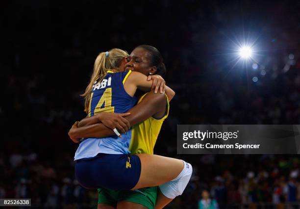 Fabiana de Oliveira and Fabiana Claudino of Brazil celebrate after winning the women's gold medal volleyball game against the United States held at...