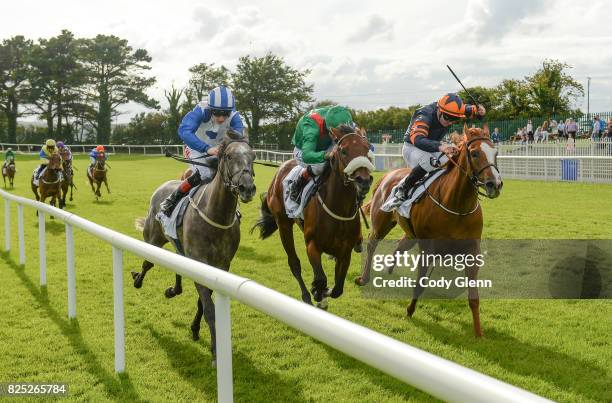 Galway , Ireland - 1 August 2017; Eventual winner Shekiba, right, with Gary Carroll up, race ahead of Raynama, with Pat Smullen up, who finished...