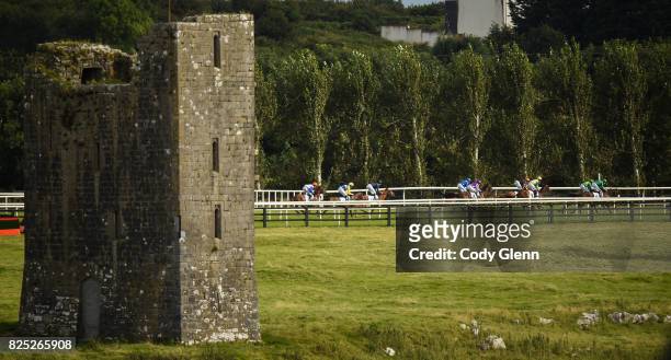 Galway , Ireland - 1 August 2017; Runners and riders race past the Ballybrit Castle during the Colm Quinn BMW Irish EBF Fillies Maiden during the...