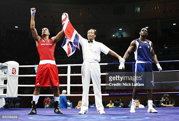James Degale of Great Britain celebrates as he is awarded victory by the judges against Emilio Correa Bayeaux of Cuba in the Men's Middle Final Bout...