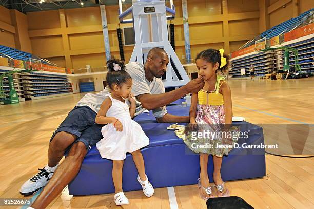 Kobe Bryant of the U.S. Men's Senior National Team celebrates his birthday with his daughters Nyla and Natalia during practice at the 2008 Beijing...
