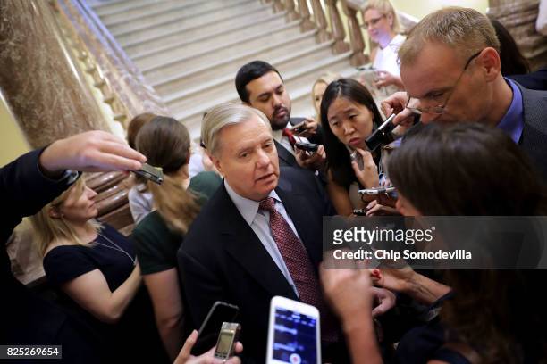 Sen. Lindsey Graham is surrounded by reporters before attending the Senate Republican policy luncheon at the U.S. Capitol August 1, 2017 in...
