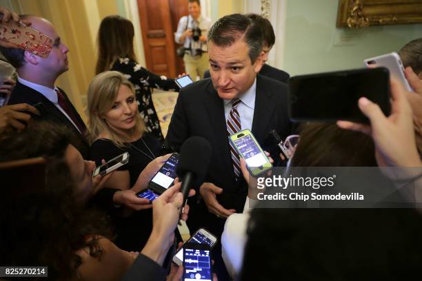 Sen. Ted Cruz is surrounded by reporters before heading into the Senate Republican policy luncheon at the U.S. Capitol August 1, 2017 in Washington,...