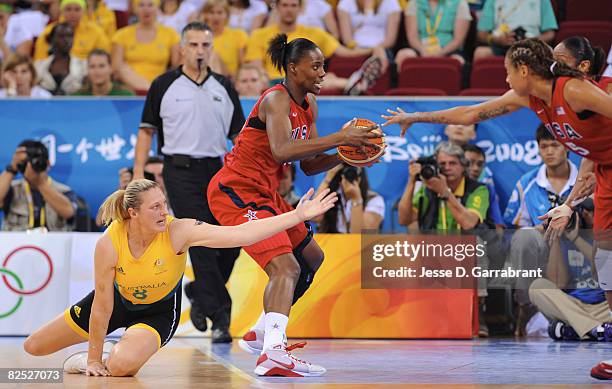 Sylvia Fowles of the U.S. Women's Senior National Team gets the ball against Suzy Batkovic of Australia during the women's gold medal basketball game...