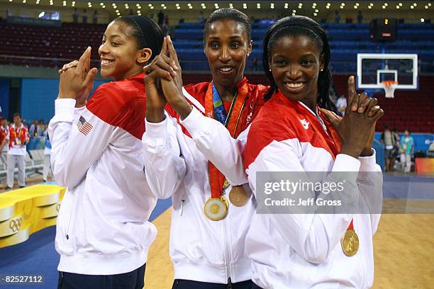 Candace Parker, Lisa Leslie and Delisha Milton-Jones pose after winning the gold medal against Australia at the Beijing Olympic Basketball Gymnasium...