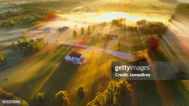 magical foggy landscape at dawn, aerial view. - wisconsin house stock pictures, royalty-free photos & images