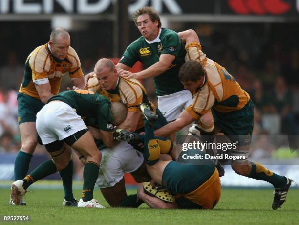 Conrad Jantes of South Africa is tackled by Stephen Moore during the 2008 Tri Nations between the South Africa Springboks and the Australian...