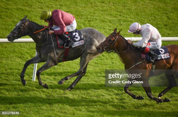 Galway , Ireland - 1 August 2017; Eventual winner Cascavelle, with Billy Lee up, race ahead of High Altitude, with Colin Keane up, who finished...