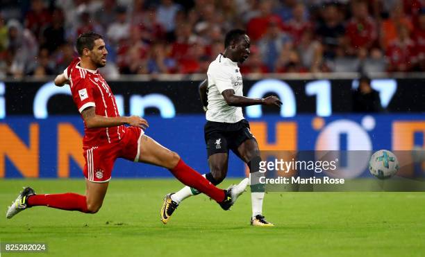 Sadio Sane of Liverpool is scoring the opening goal during the Audi Cup 2017 match between Bayern Muenchen and Liverpool FC at Allianz Arena on...