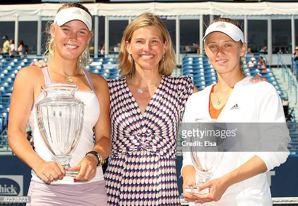 Caroline Wozniacki of Denmark with her championship trophy , tournament director Anne Worcester and Anna Chakvetadze of Russia, with her second place...