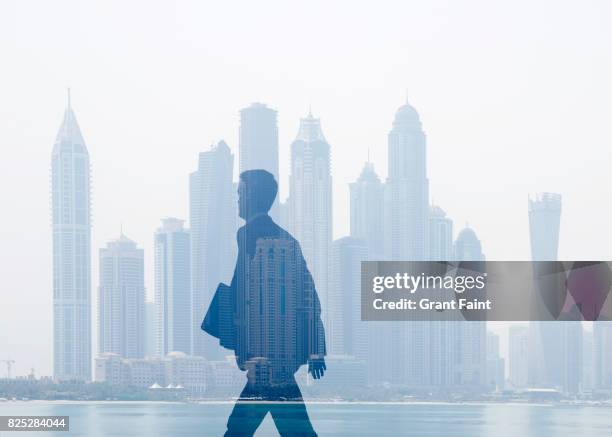 executive businessman in double exposure. - city walk dubai stockfoto's en -beelden