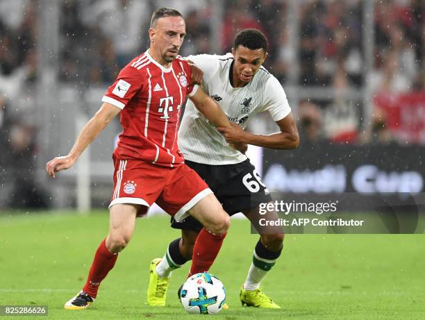 Liverpool's defender Trent Alexander-Arnold and Bayern Munich's French midfielder Franck Ribery vie for the ball during the second Audi Cup football...