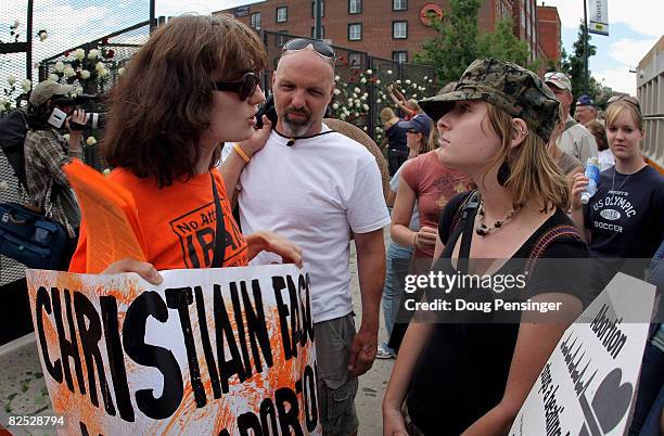 Pro Choice activist Lina Thorn and member of World Can't Wait and Pro Life activist Amanda Lord of the Christian Defense Coalition square off outside...