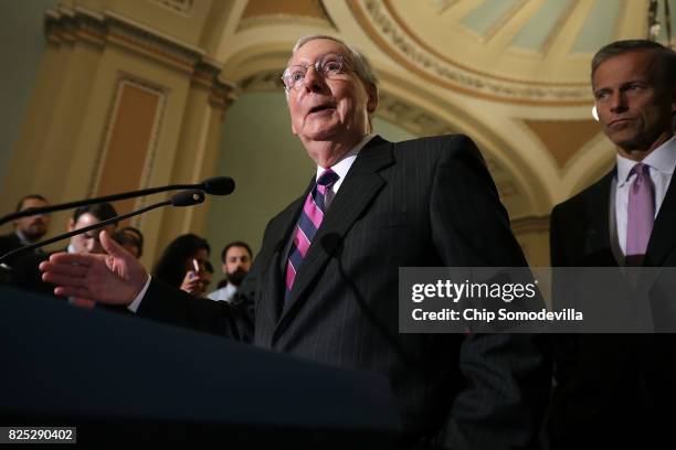 Senate Majority Leader Mitch McConnell talks with reporters with Sen. John Thune following the Republican Senate policy luncheon at the U.S. Capitol...