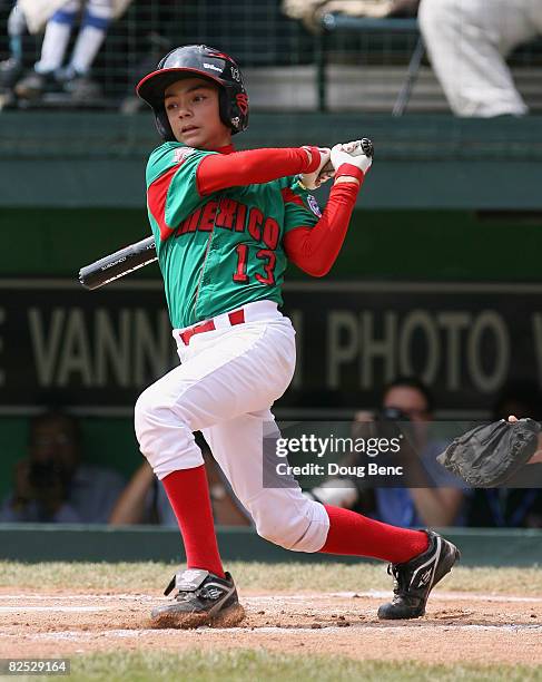 Jose Rodriguez of Mexico follows his hit against Japan in the International Final at Lamade Stadium on August 23, 2008 in Williamsport, Pennsylvania....