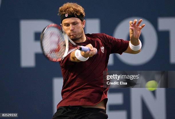 Mardy Fish returns a shot to Marin Cilic of Croatia in the men's singles championship match during Day 6 of Pilot Pen Tennis on August 23, 2008 at...