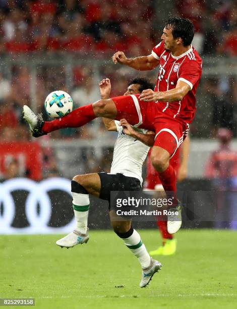 Mats Hummels of Muenchen and Mohamed Salah of Liverpool battle for the ball during the Audi Cup 2017 match between Bayern Muenchen and Liverpool FC...
